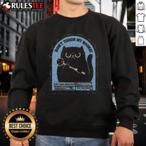 Funny cat on a sweatshirt with the phrase Don't Touch My Books, perfect for book lovers and cat enthusiasts.