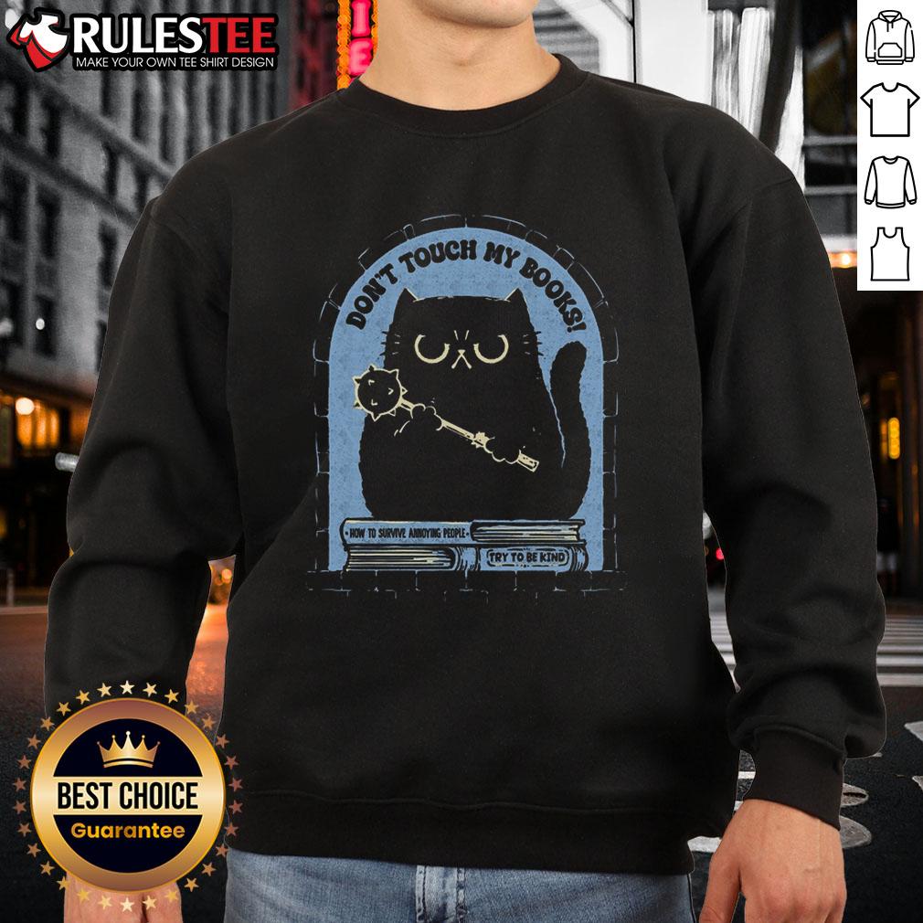 Funny cat on a sweatshirt with the phrase Don't Touch My Books, perfect for book lovers and cat enthusiasts.