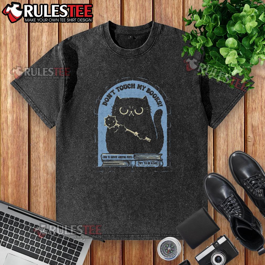 Funny cat graphic on a 'Don't Touch My Books' washed t-shirt, perfect for cat lovers and book enthusiasts.