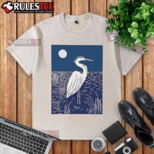 Alt Text: Pretty woodcut crested ibis heron moonlight linocut design on a washed t-shirt, showcasing artistic wildlife print.
