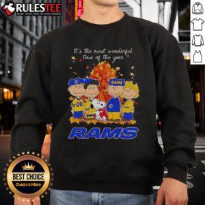 Alt Text: Awesome Peanuts character sweatshirt for Los Angeles Rams, celebrating the holiday season with festive cheer.