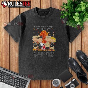 Alt Text: Awesome Peanuts character on a New Orleans Saints 'Most Wonderful Time of the Year' washed t-shirt design.