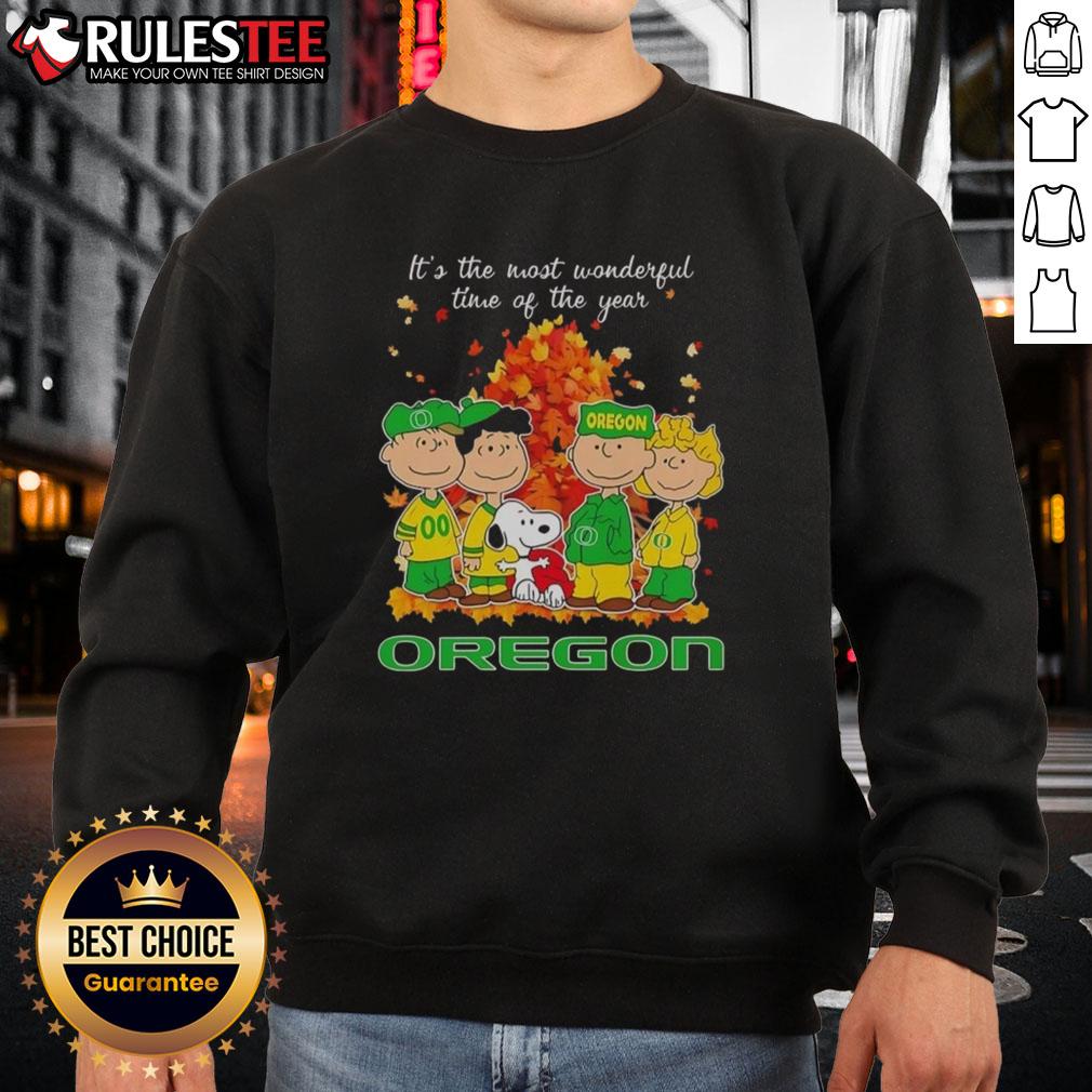 Alt Text: Awesome Peanuts character Oregon Ducks sweatshirt for the holiday season - perfect for fans and festive cheer.