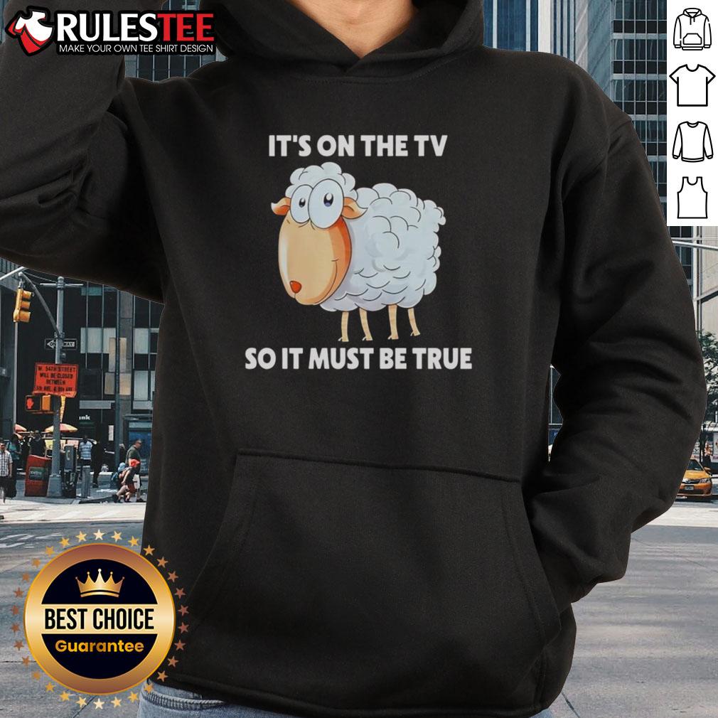 Funny sheep hoodie featuring 'It's on the TV, so it must be true' graphic, perfect for casual wear and humor lovers.