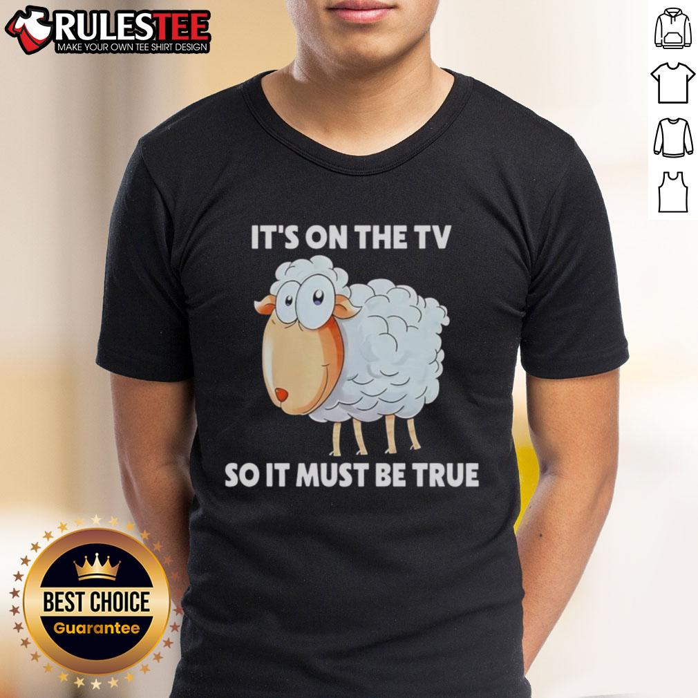 Alt Text: Funny Sheep It's On The TV So It Must Be True T-Shirt featuring a cartoon sheep design for humor lovers.