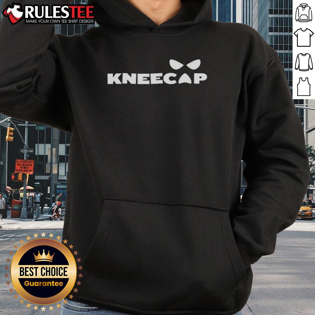 Sami Zayn wearing a stylish kneecap hoodie, showcasing his unique fashion sense in a casual setting.