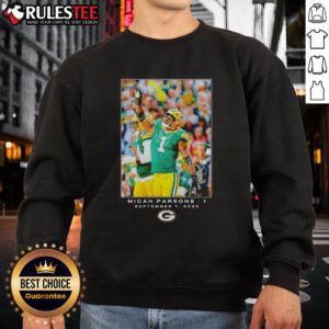 Micah Parsons wearing a Nice Green Bay sweatshirt featuring Flash design during Week 1 of the NFL season.