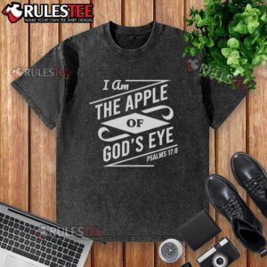 Nice I Am The Apple Of Gods Eye washed t-shirt in vibrant colors displayed on a wooden background, showcasing unique design.