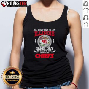 Alt Text: Woman wearing a Kansas City Chiefs tank top, showcasing team pride despite living in Illinois on game day.