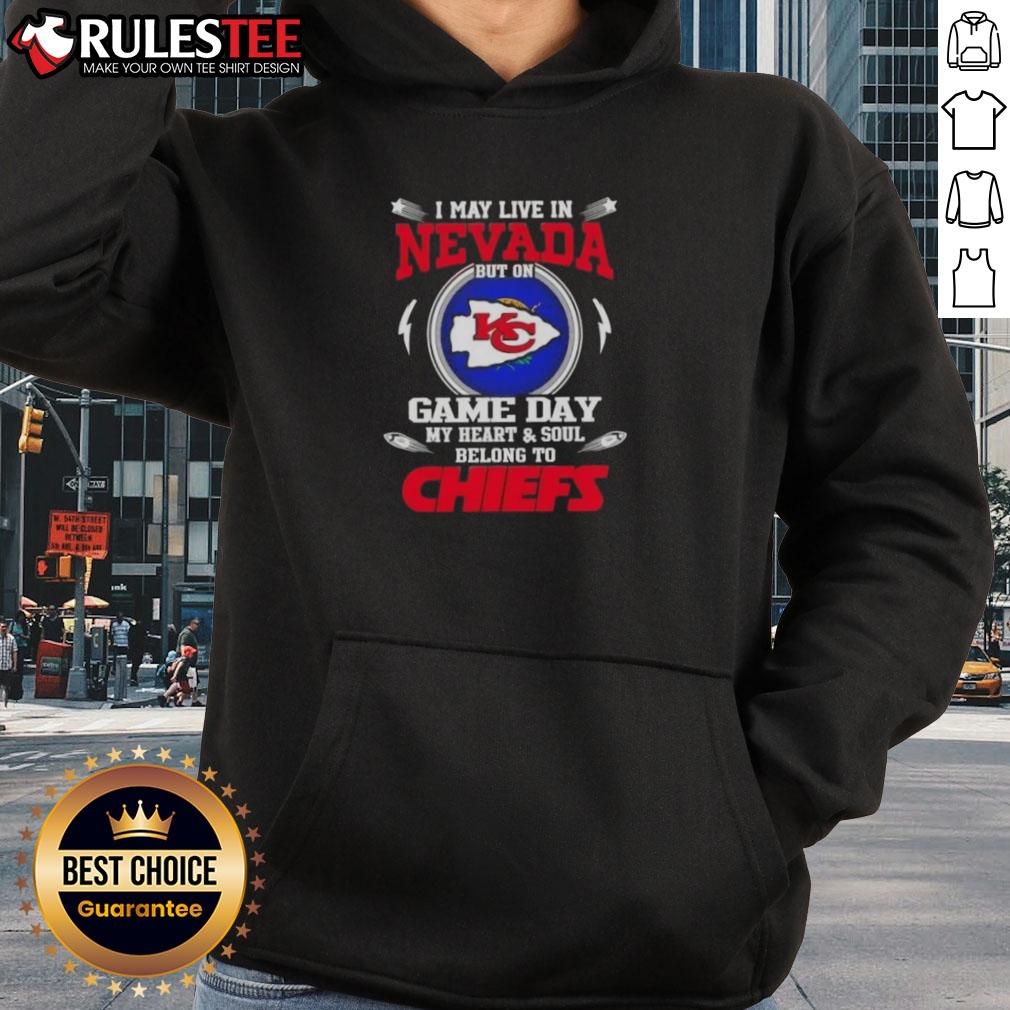 Alt Text: Woman in a Kansas City Chiefs hoodie, smiling in Nevada, showcasing her team spirit on game day.