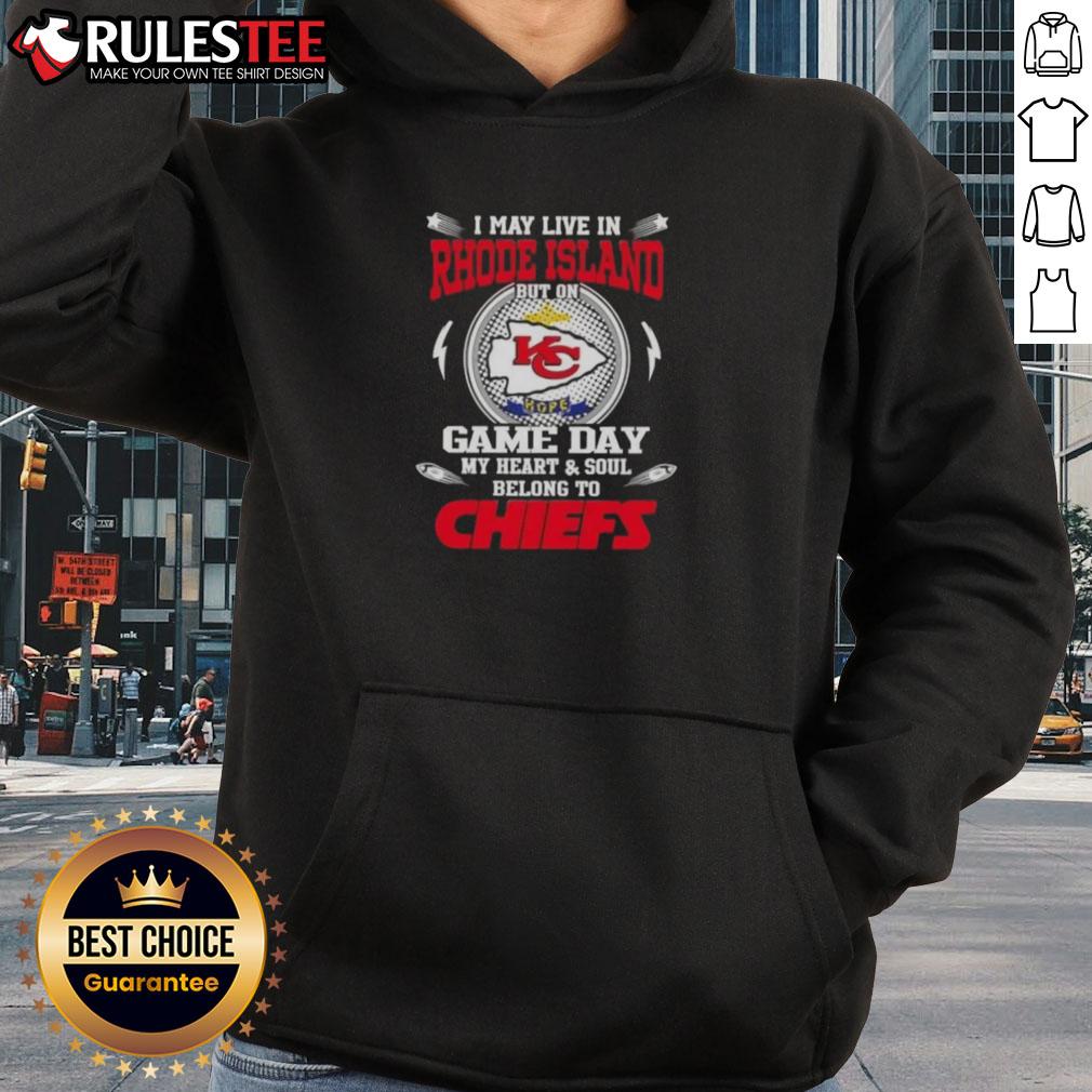 Cheerful fan in Kansas City Chiefs hoodie, expressing loyalty on game day, showcasing pride for the team in Rhode Island.